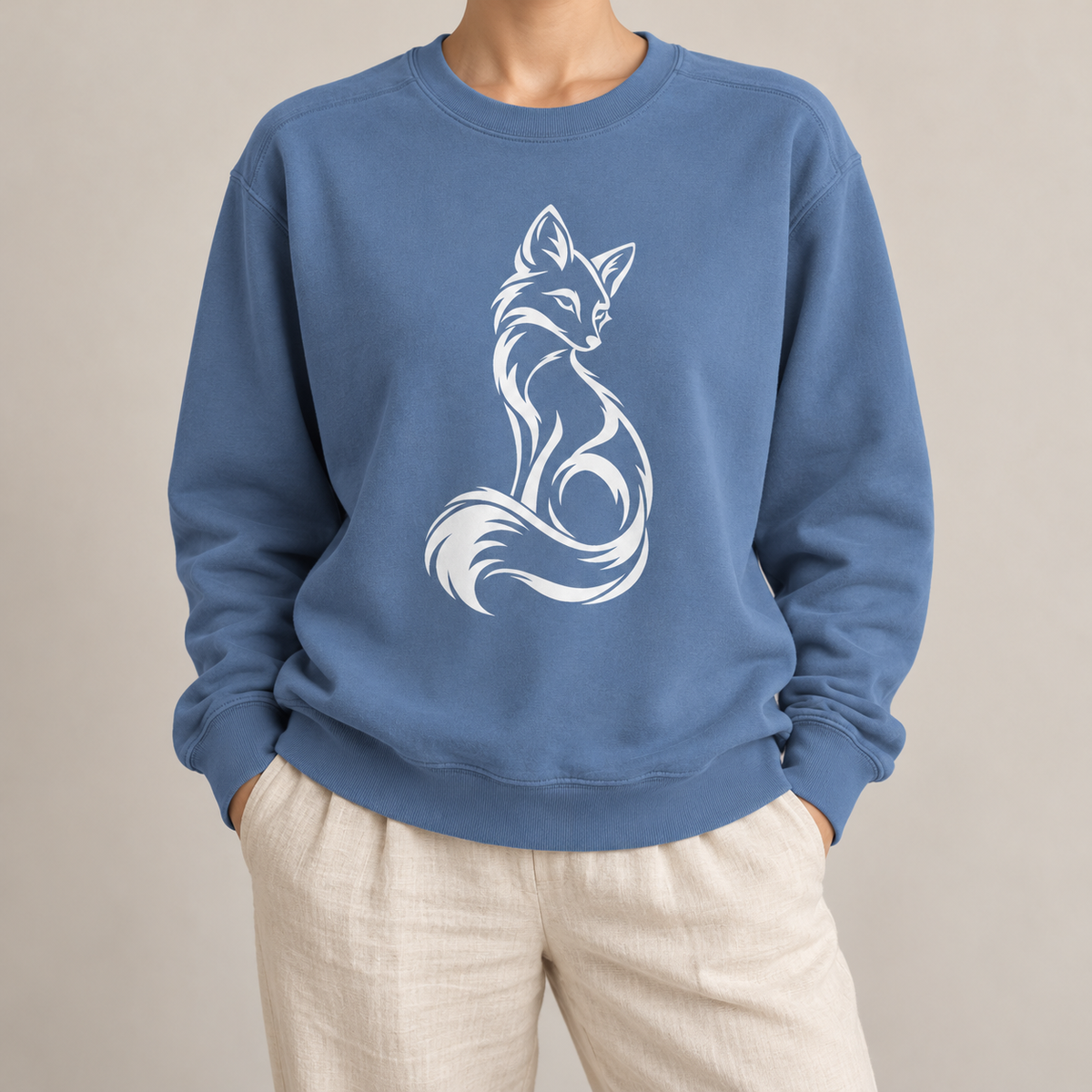 Elegant Seated Fox Linework Sweatshirt in Blue Jean - white line-art fox sitting with its tail curled, looking back over its shoulder, on a garment-dyed Comfort Colors crewneck