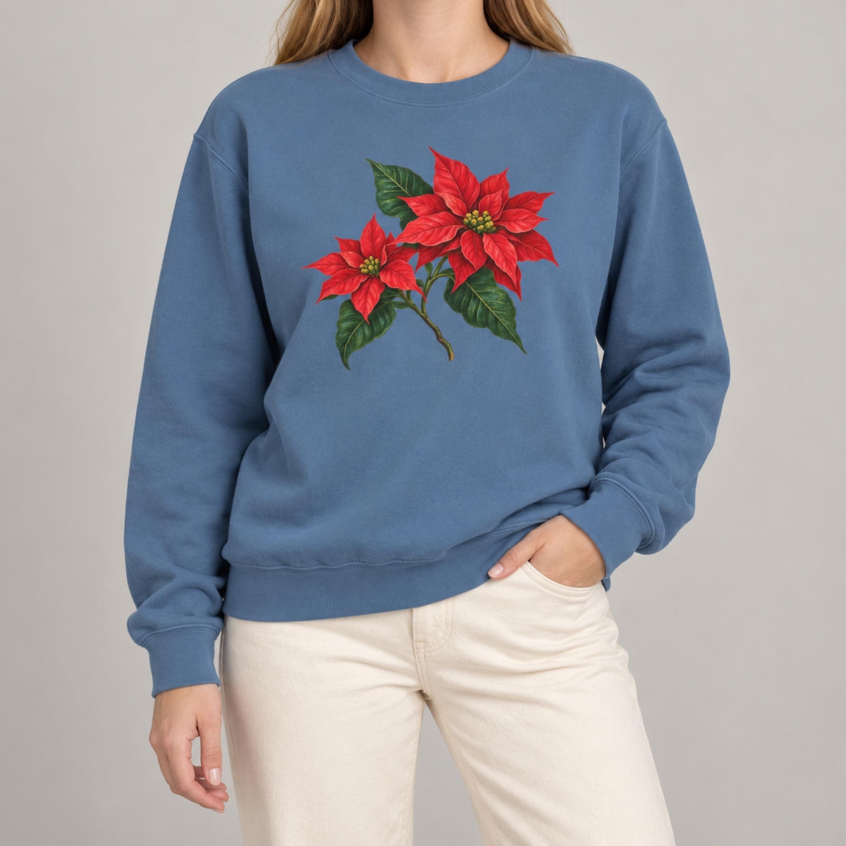 Poinsettia sweatshirt in Blue Jean worn, red poinsettia sprig across the chest