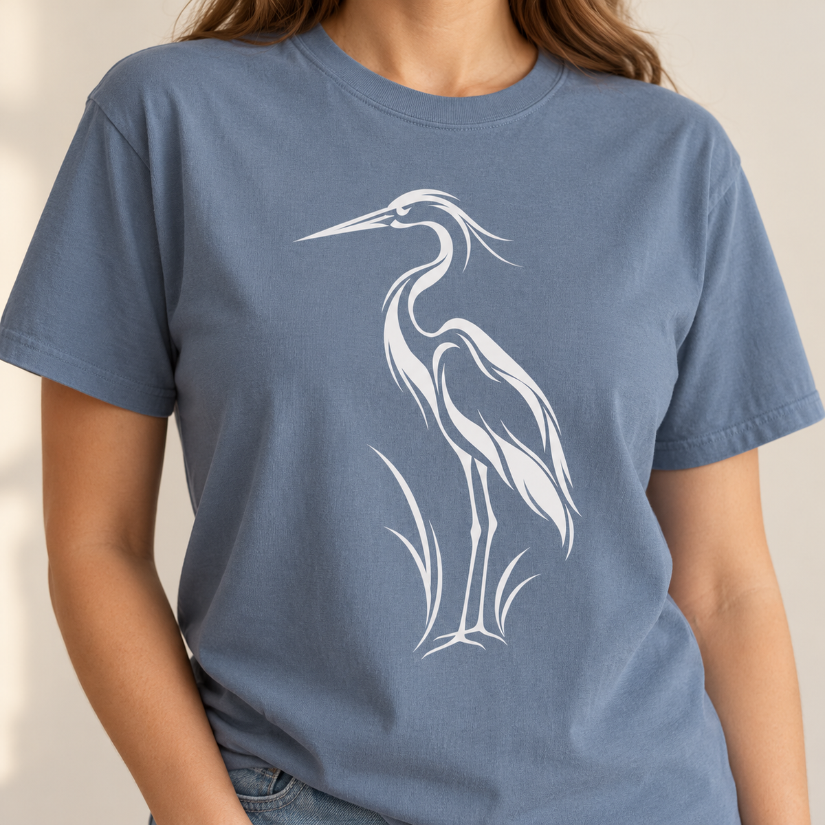 Flowing Great Blue Heron T-Shirt in Blue Jean, second view — white line-art heron on a garment-dyed Comfort Colors tee