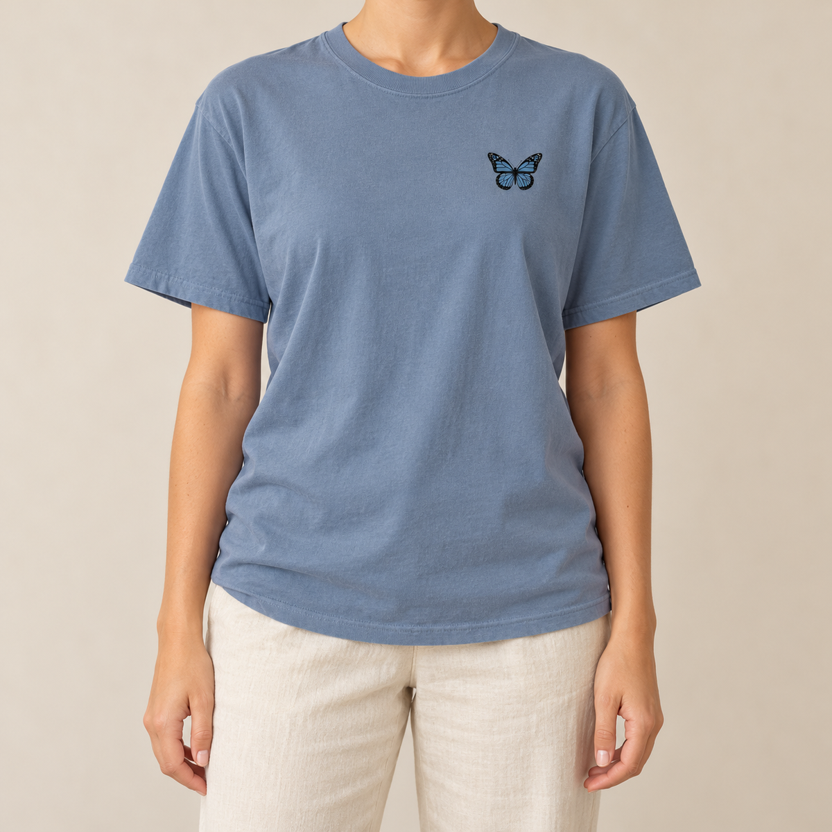 Monarch Butterfly Front and Back T-Shirt in Blue Jean, front view - small monarch at the chest of a garment-dyed tee
