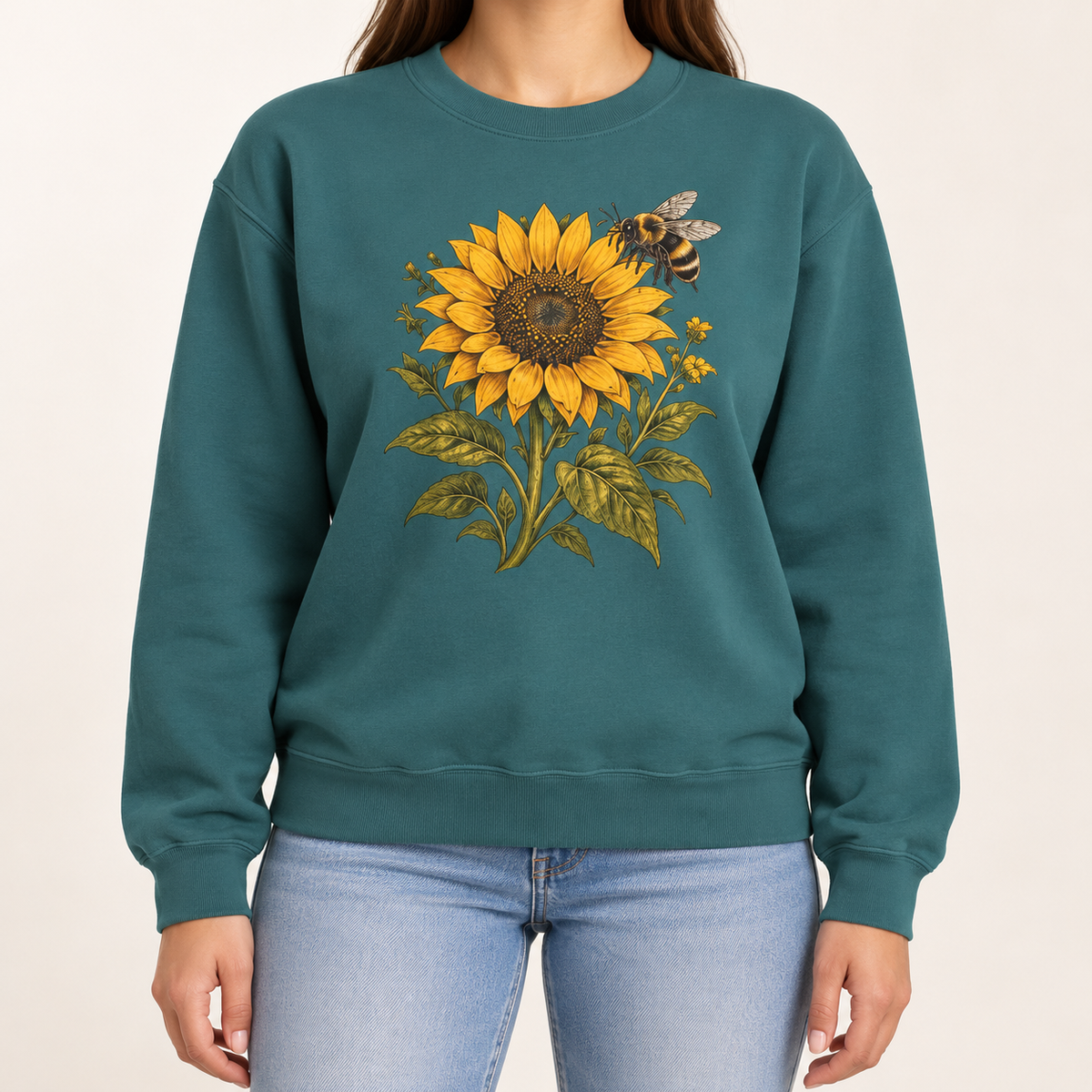 Sunflower and bumblebee sweatshirt in Blue Spruce: a golden sunflower with a hovering bumblebee and olive leaves, on a deep forest green garment-dyed Comfort Colors crewneck