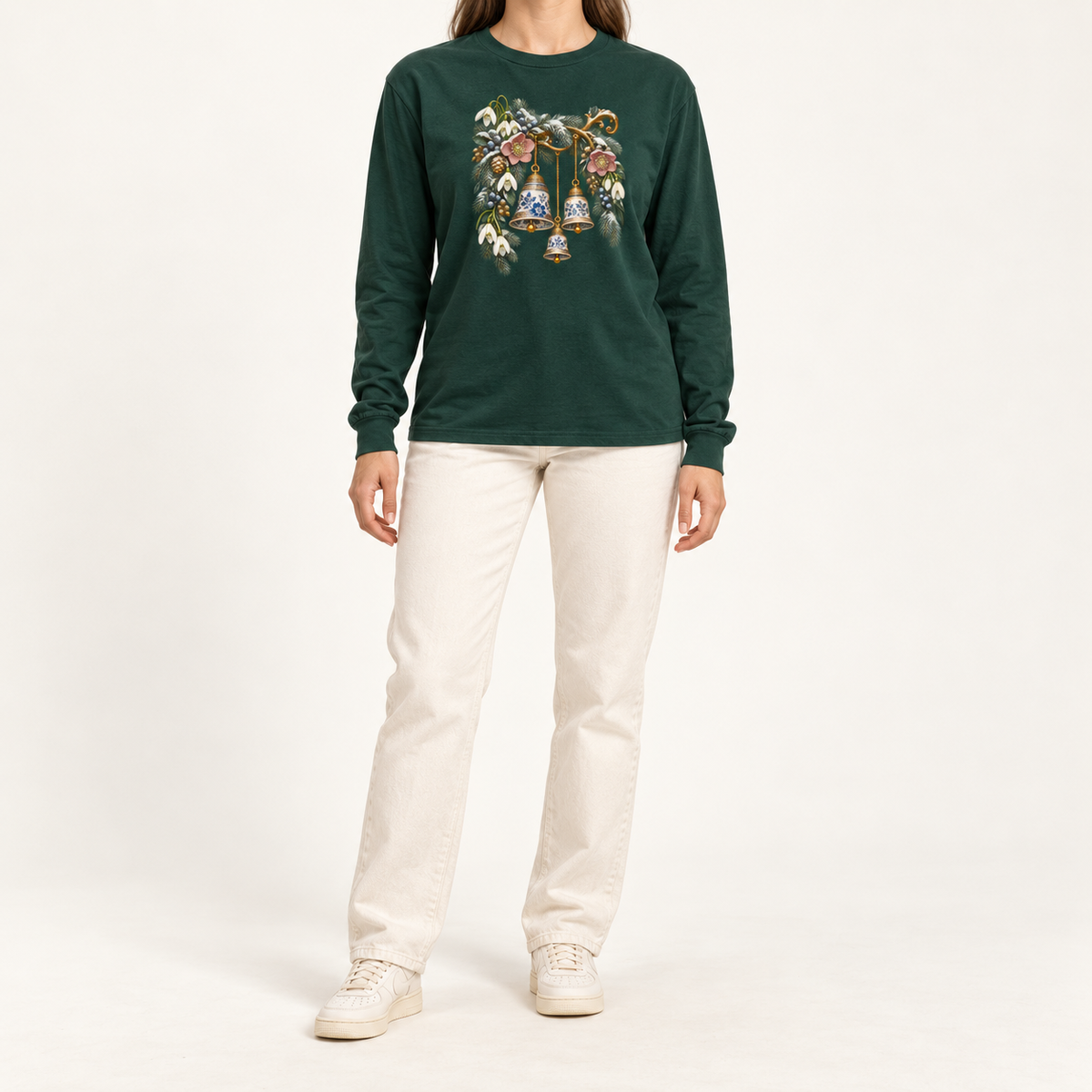 Winter bells bell-graphic print on a forest green 6 oz Airlume cotton long sleeve crewneck — blue-and-white porcelain bells among winter botanicals