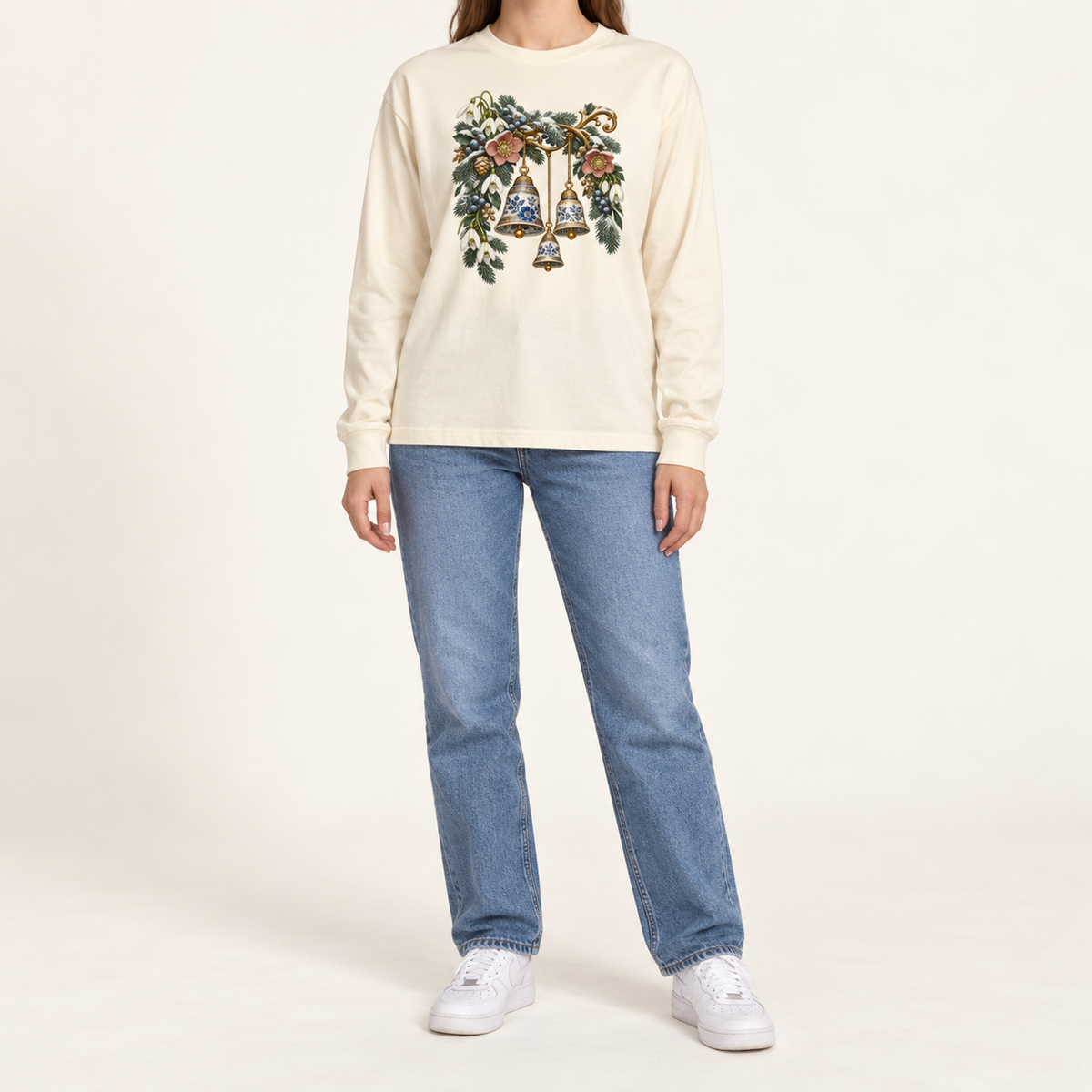 Porcelain winter bells graphic print on a heavyweight Bella+Canvas 3511 long sleeve tee — blue-and-white porcelain bells among winter botanicals