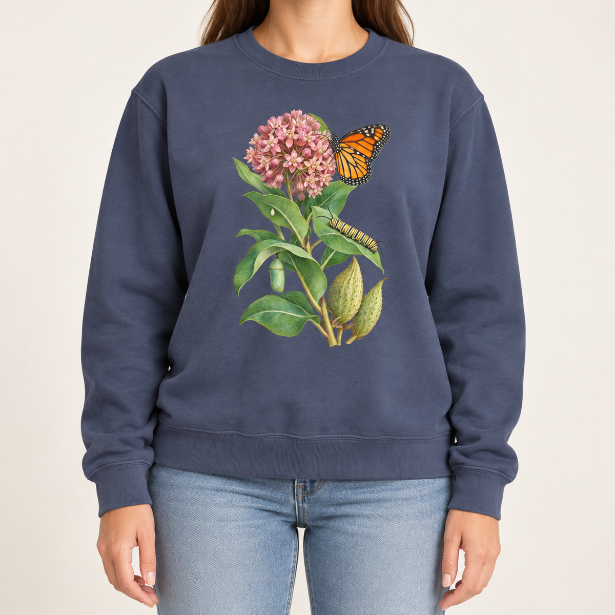 Milkweed and monarch life cycle sweatshirt in Denim, pink milkweed and orange monarch on a dark indigo Comfort Colors crewneck