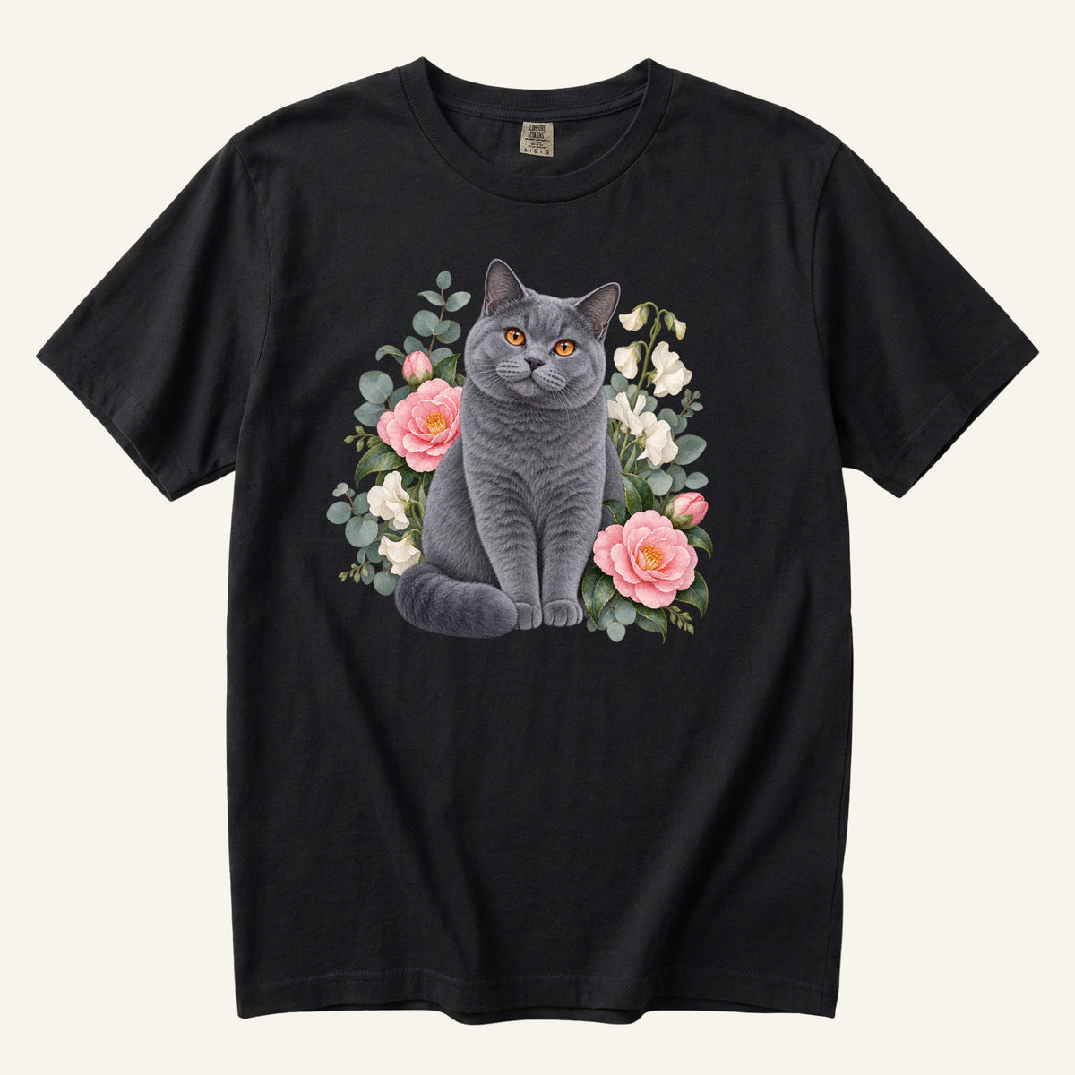 British Shorthair Cat T-Shirt in Black — botanical cat portrait with camellias, centered front print