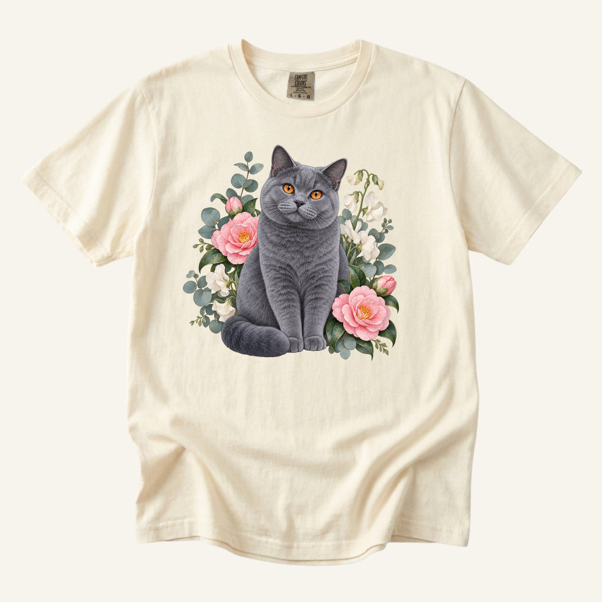 British Shorthair Cat T-Shirt in Ivory — copper-eyed cat among camellias, sizes S to 4XL