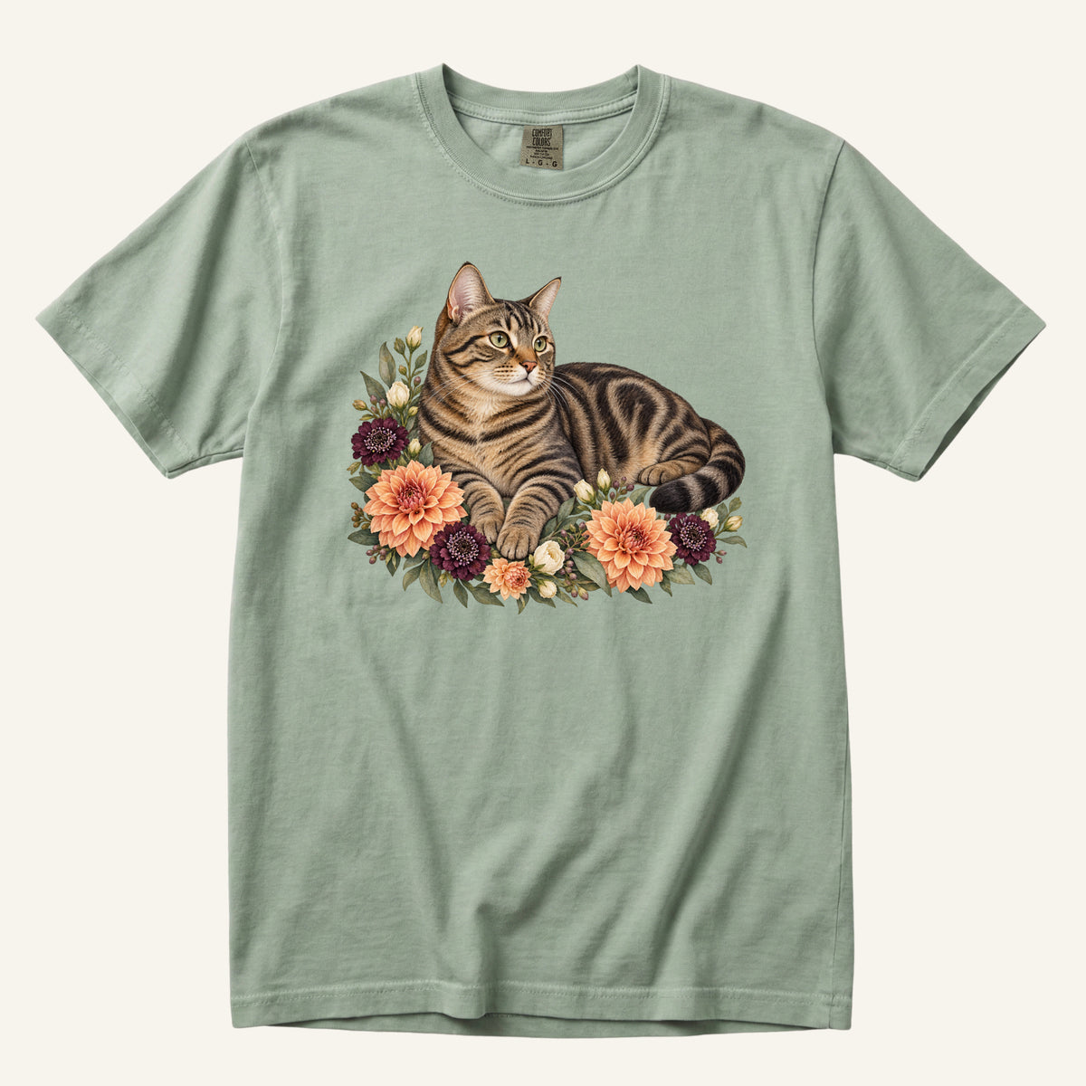 Brown Tabby Cat T-Shirt in Bay — a brown tabby cat among peach dahlias on garment-dyed cotton