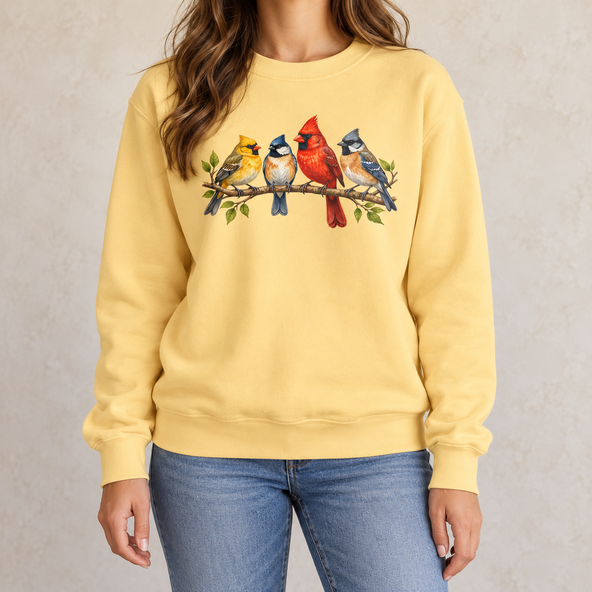 Four Colorful Songbirds on a Leafy Branch Sweatshirt in Butter - four watercolor songbirds on a soft yellow garment-dyed crewneck