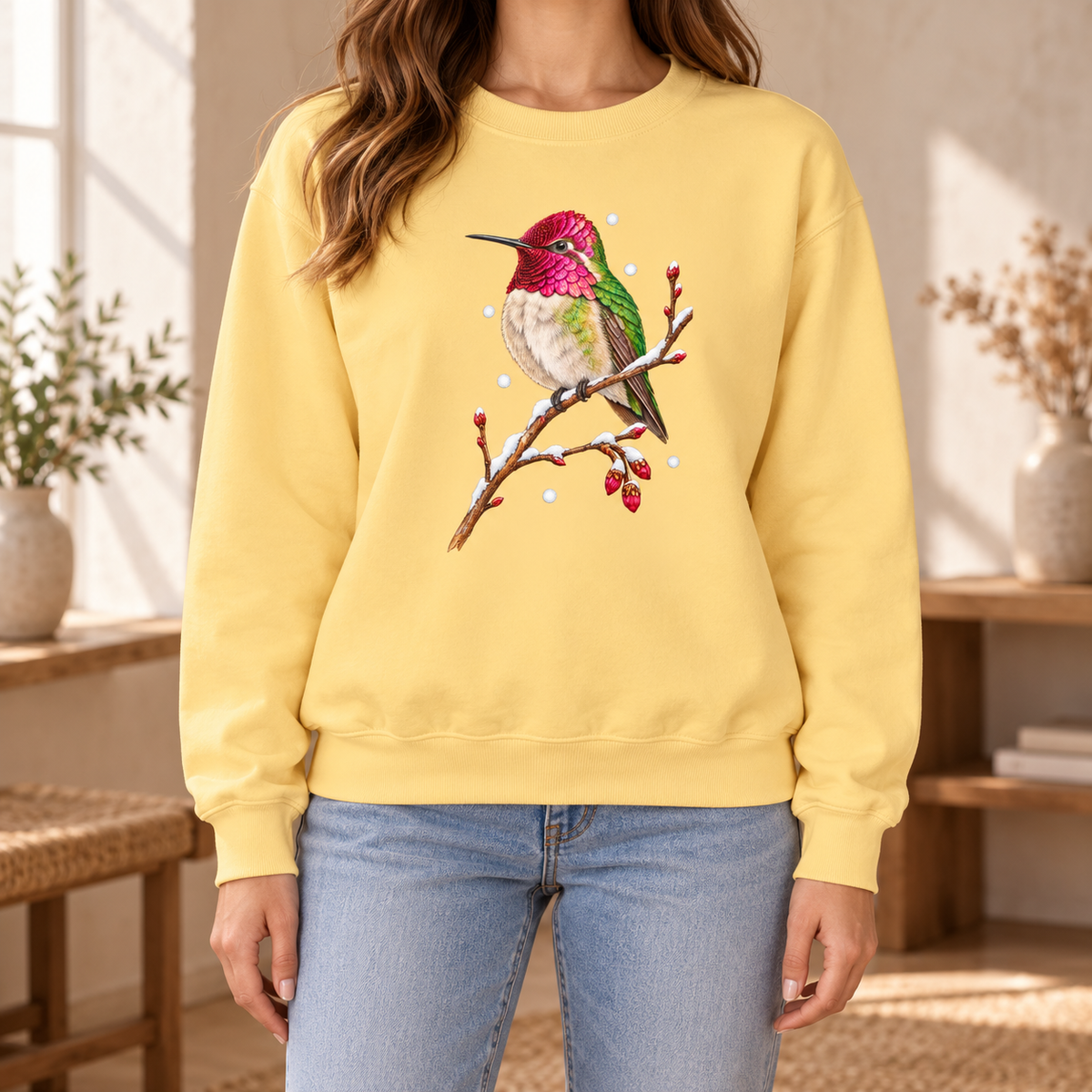 Winter Hummingbird Sweatshirt in Butter - a watercolor Anna's hummingbird with a magenta head perched on a snowy twig, printed on a garment-dyed Comfort Colors 1566 crewneck
