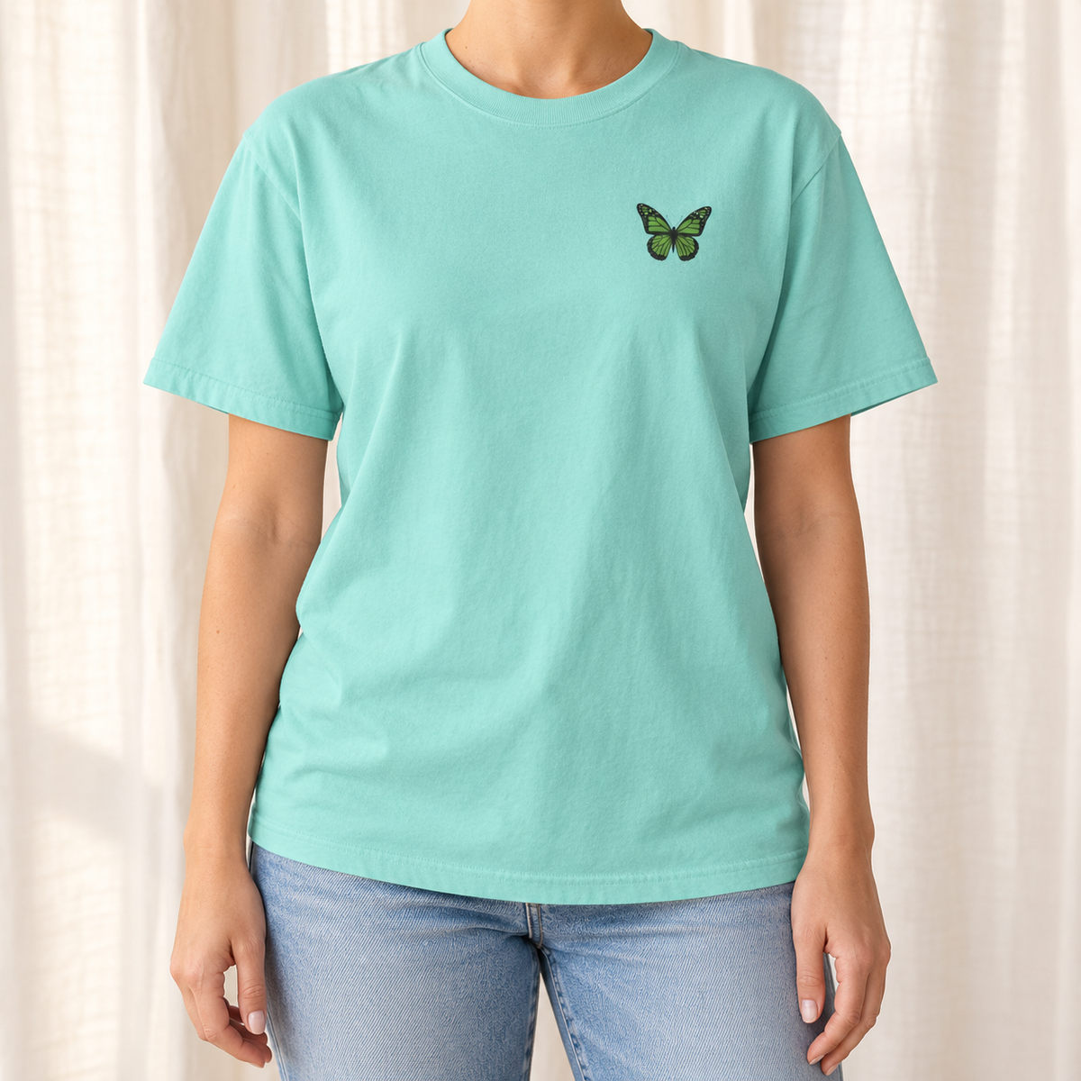 Monarch Butterfly Front and Back T-Shirt in Chalky Mint, front view - small monarch at the chest of a garment-dyed Comfort Colors tee