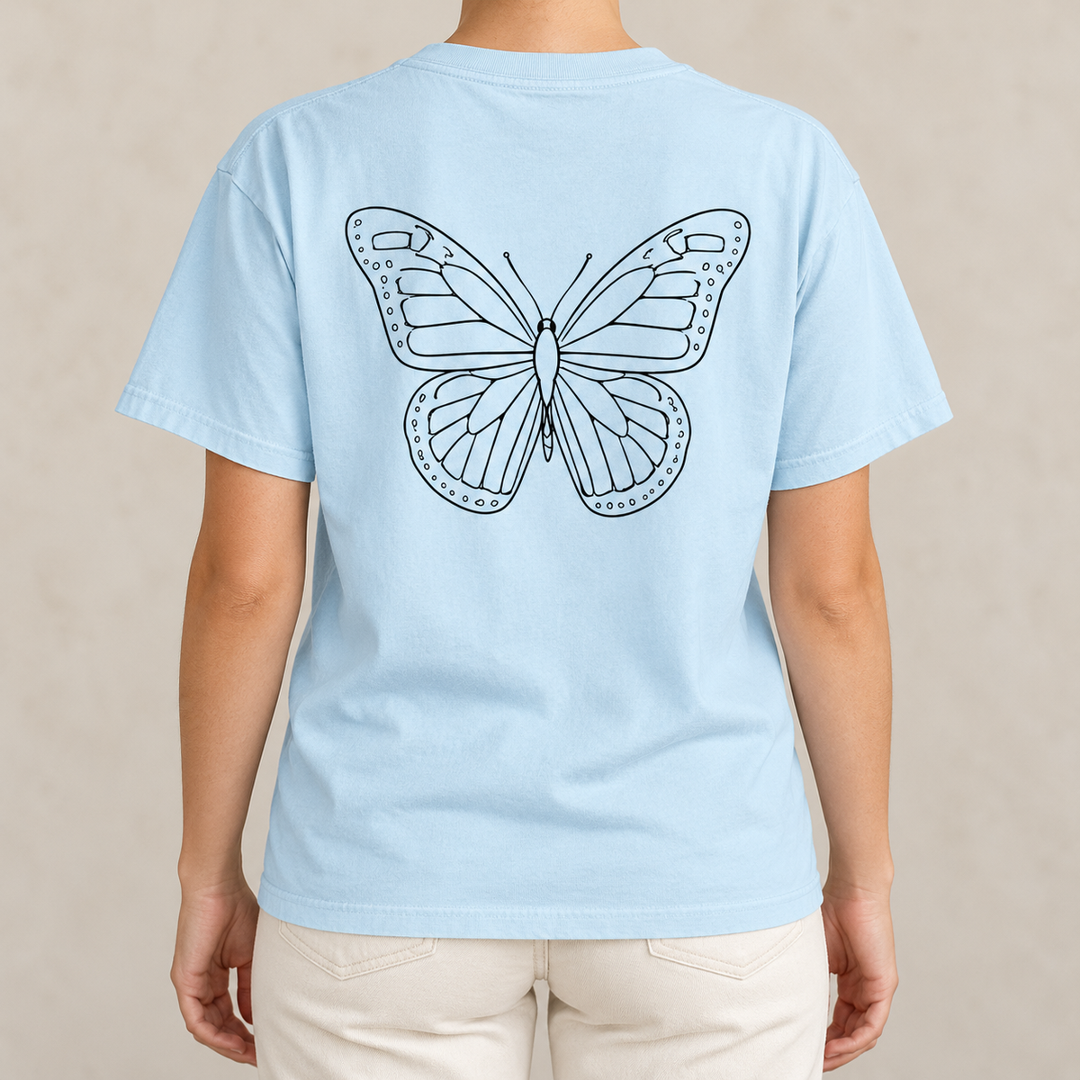 Monarch Butterfly Front and Back T-Shirt in Chambray, back view - line-art monarch on light blue garment-dyed cotton