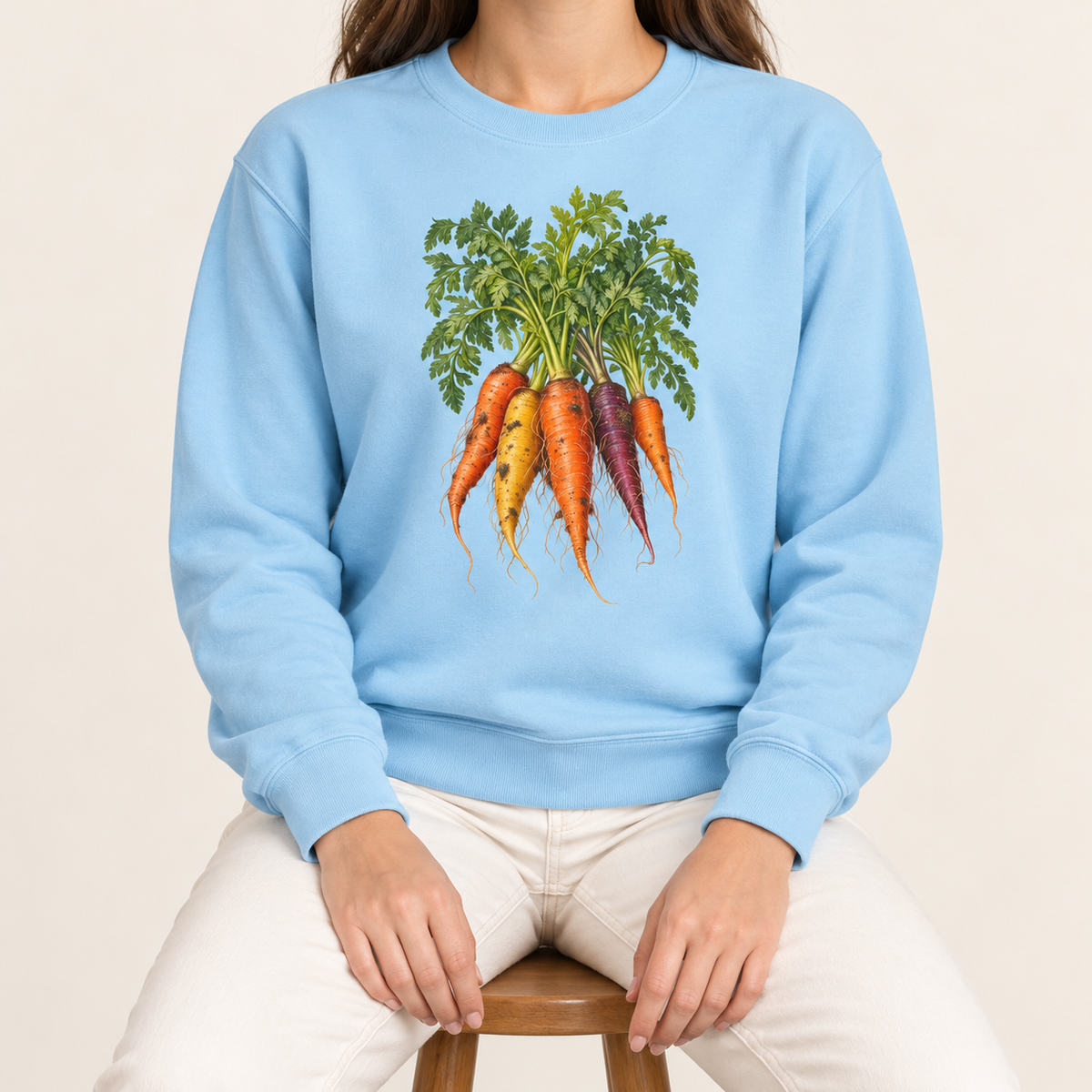 Heirloom carrot sweatshirt in Chambray – orange, gold and purple rainbow carrots with feathery green tops, printed large on the chest of a Comfort Colors crewneck