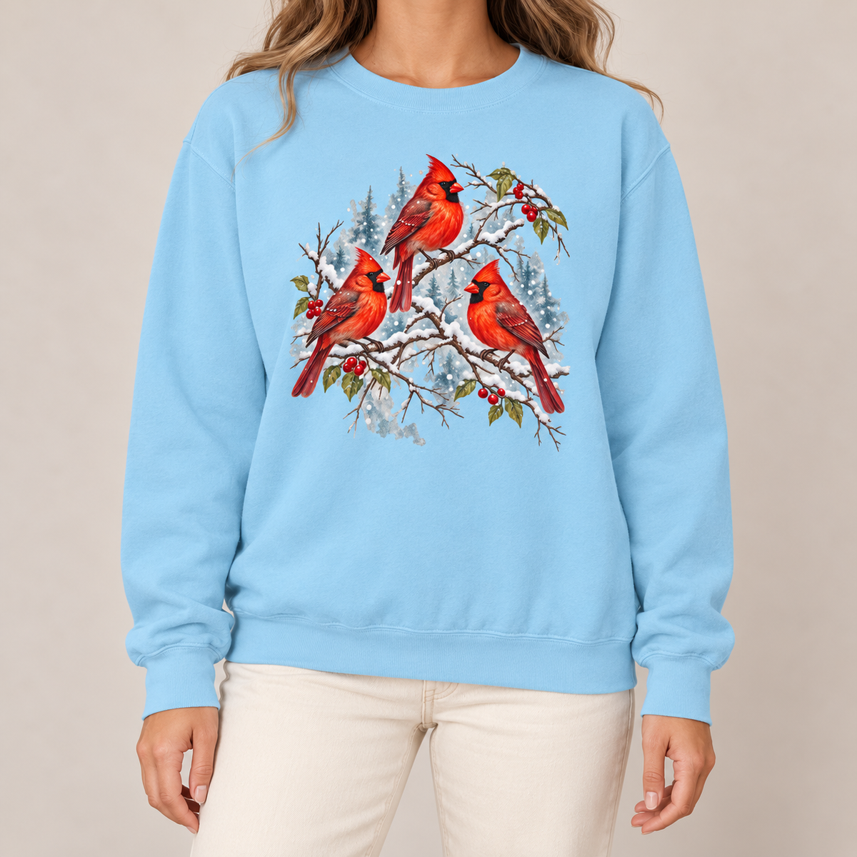 Three Snowy Cardinals on Berry Branches Sweatshirt in Chambray - cardinal trio watercolor print on a pale blue garment-dyed crewneck sweatshirt