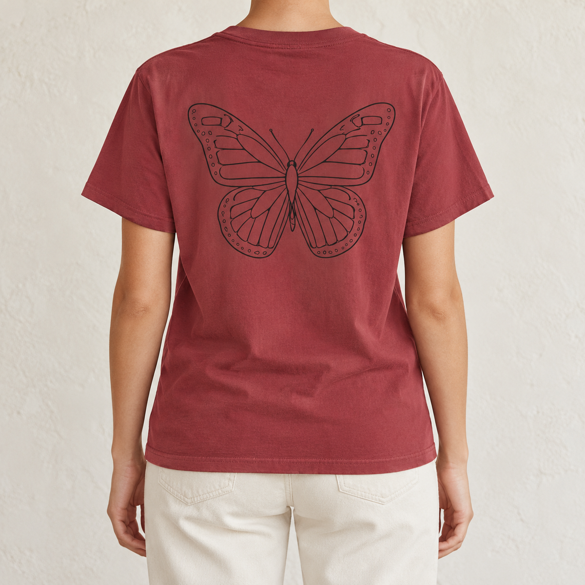 Monarch Butterfly Front and Back T-Shirt in Chili, back view - black line-art monarch on brick red garment-dyed cotton