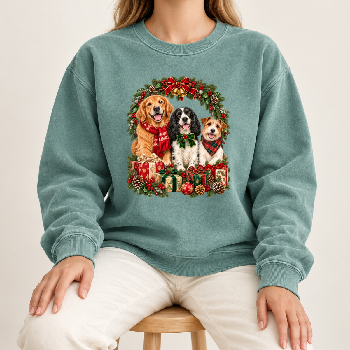The three-dog Christmas wreath print shown large and centered on the chest of a garment-dyed Comfort Colors crewneck sweatshirt, not a back print