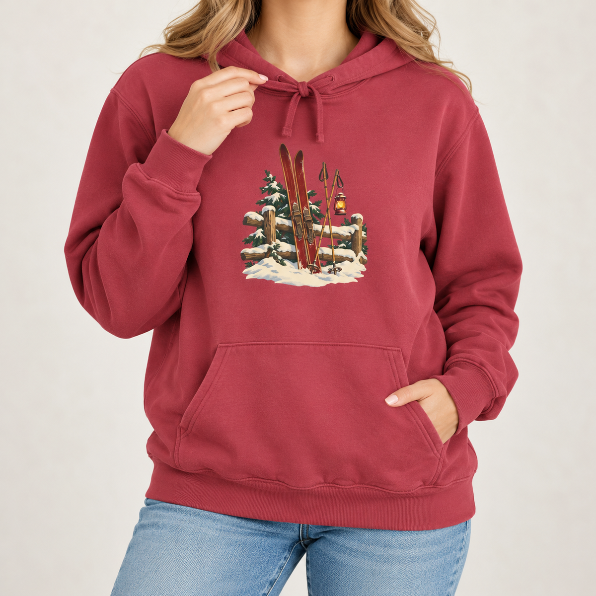 Vintage Ski Lodge hoodie in Crimson worn, front view with the small skis-and-fence print