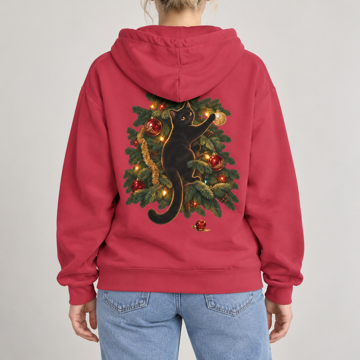 Black Cat Christmas hoodie in Crimson worn, back view with the cat climbing the Christmas tree