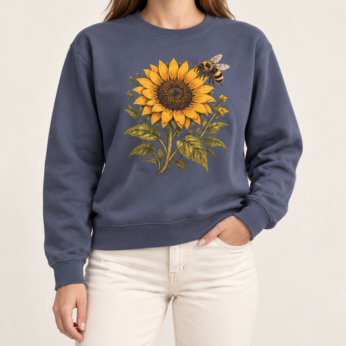 Sunflower and bumblebee sweatshirt in Denim: a golden sunflower with a hovering bumblebee and olive leaves, on a dark washed indigo garment-dyed Comfort Colors crewneck