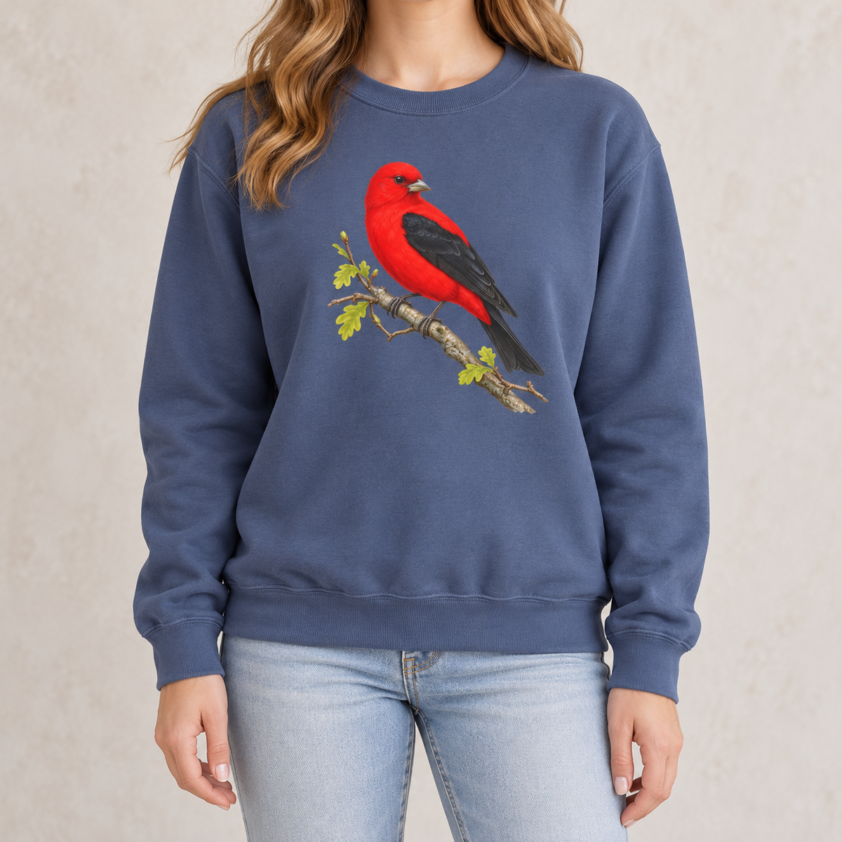 Scarlet Tanager sweatshirt in Denim — red bird with black wings on a spring oak branch, garment-dyed Comfort Colors crewneck