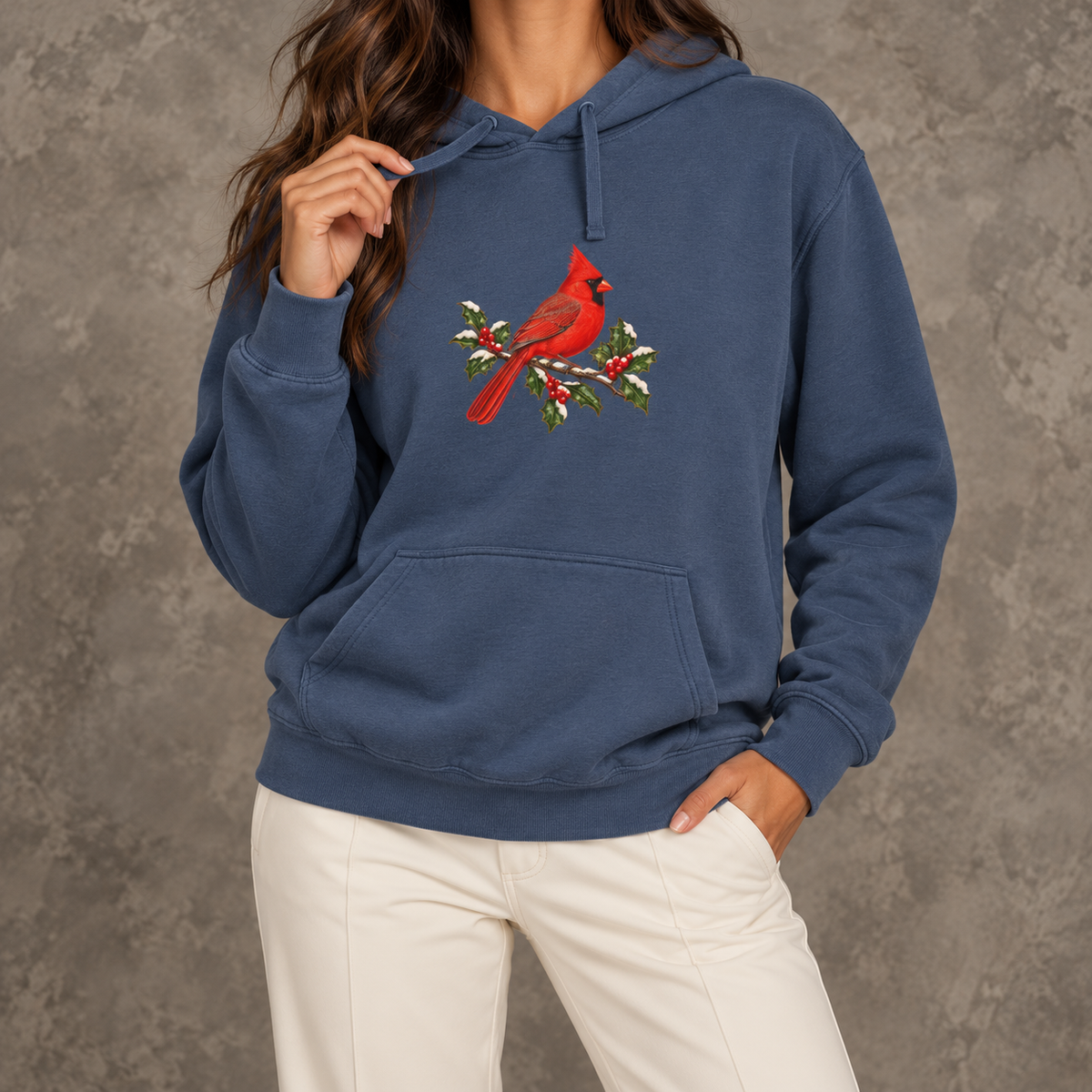Winter Cardinal hoodie in Denim worn, front view with the cardinal on snowy holly