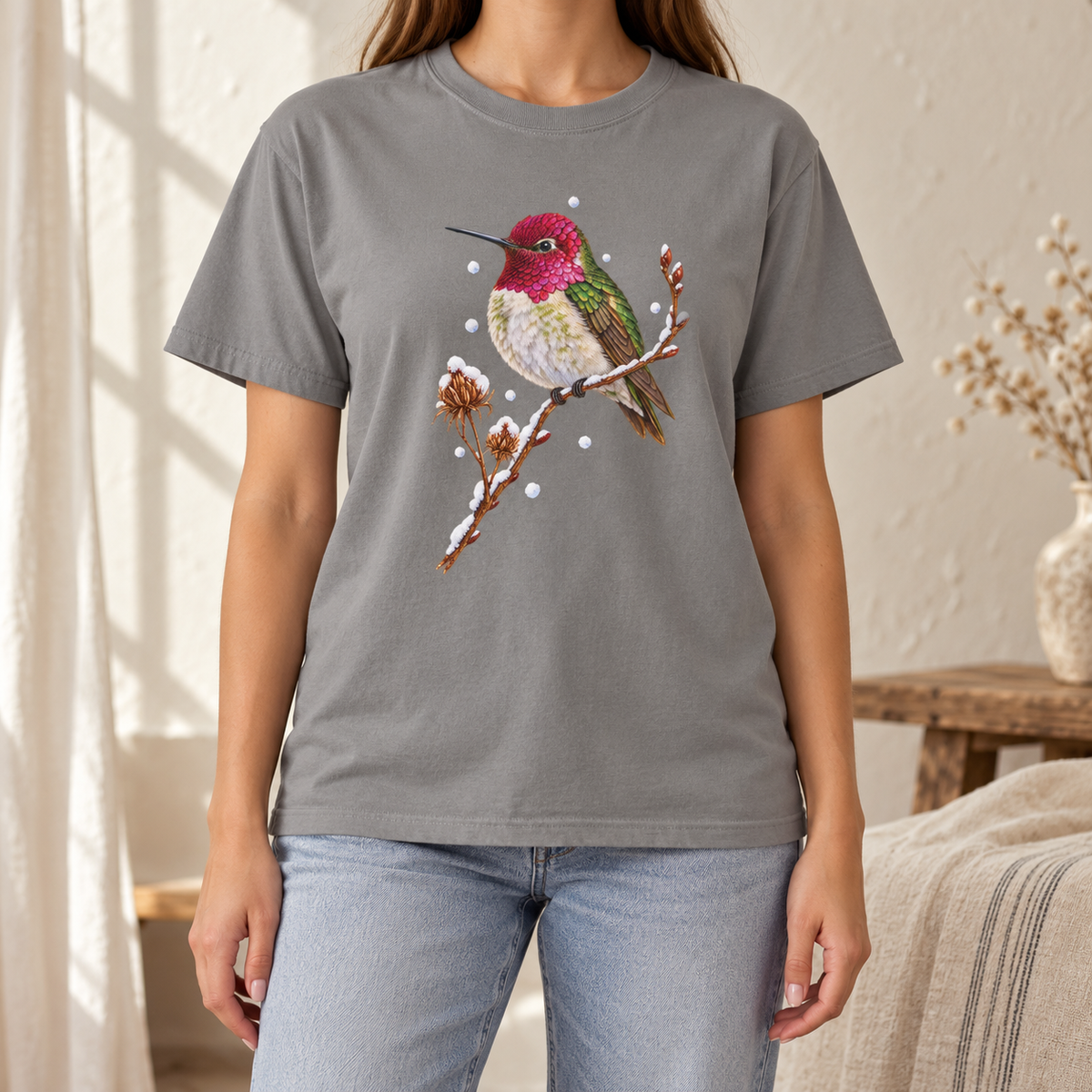 Winter Hummingbird T-Shirt in Grey - a watercolor Anna's hummingbird with a magenta head perched on a snowy twig, printed on a garment-dyed Comfort Colors 1717 cotton tee