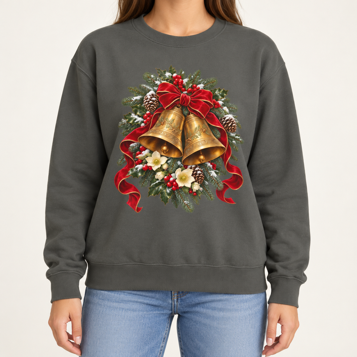 Vintage Christmas bells sweatshirt – two golden bells with a red velvet bow among snowy pine, holly, pinecones and hellebores, printed large on the chest of a Comfort Colors crewneck