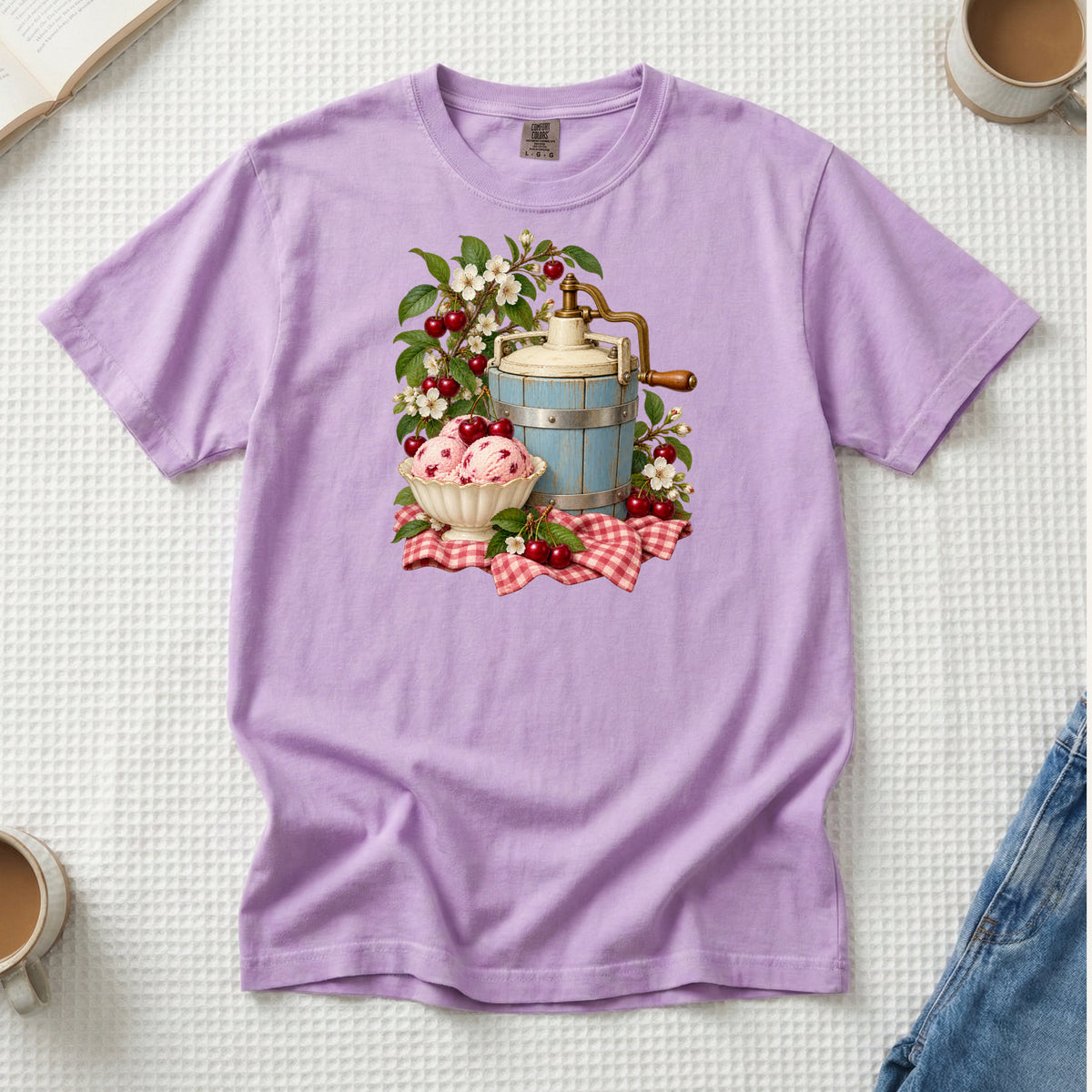 Vintage blue ice cream churn with a bowl of cherry ice cream, ripe cherries and red gingham, printed on an Orchid lavender Comfort Colors 1717 unisex t-shirt