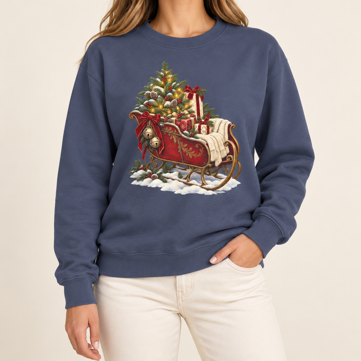 Vintage Christmas sleigh sweatshirt – a cranberry-red sleigh with gold trim heaped with fresh-cut fir and hung with golden bells, printed large on the chest of a garment-dyed Comfort Colors crewneck