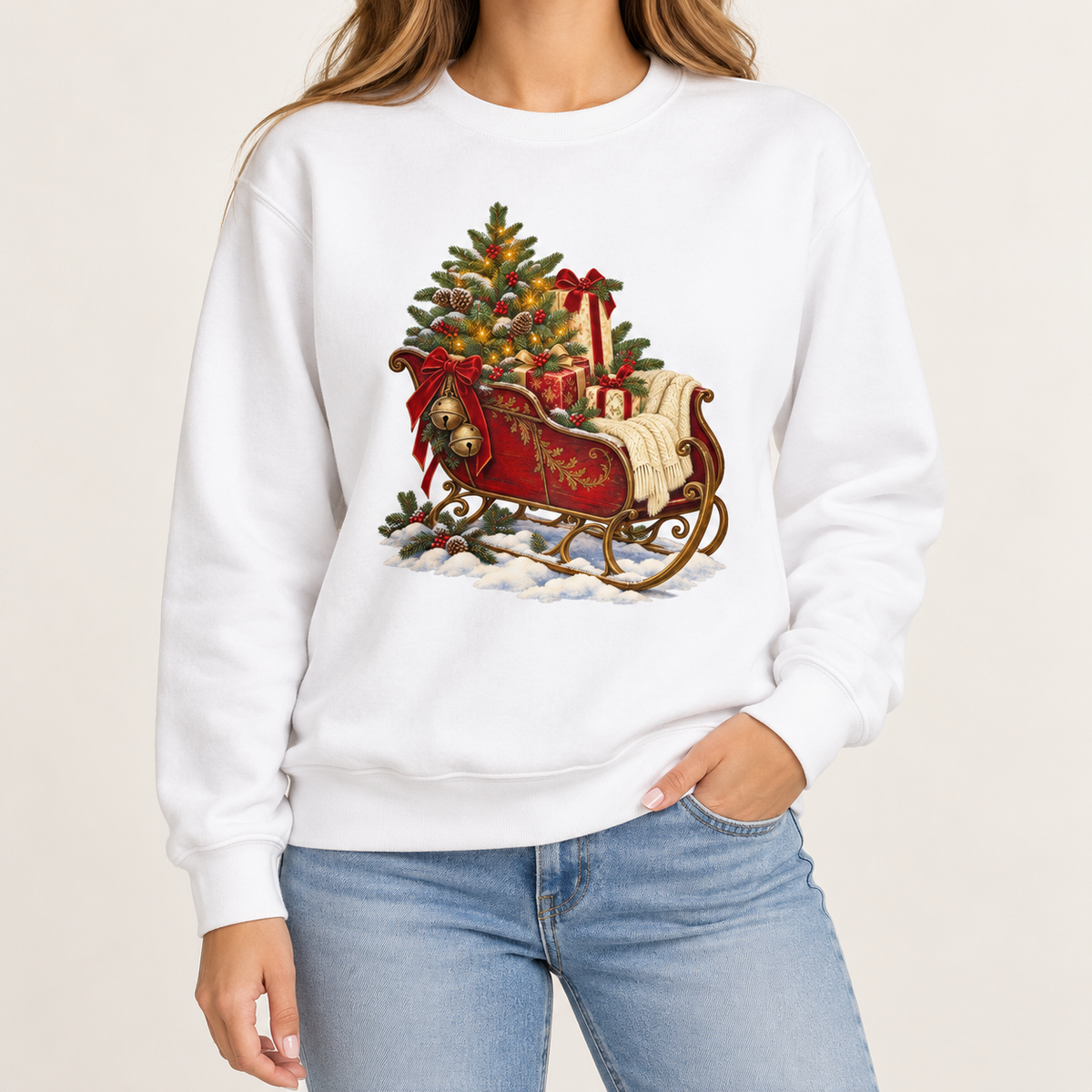Vintage Christmas sleigh sweatshirt – a cranberry-red sleigh with gold trim heaped with fresh-cut fir and hung with golden bells, printed large on the chest of a garment-dyed Comfort Colors crewneck