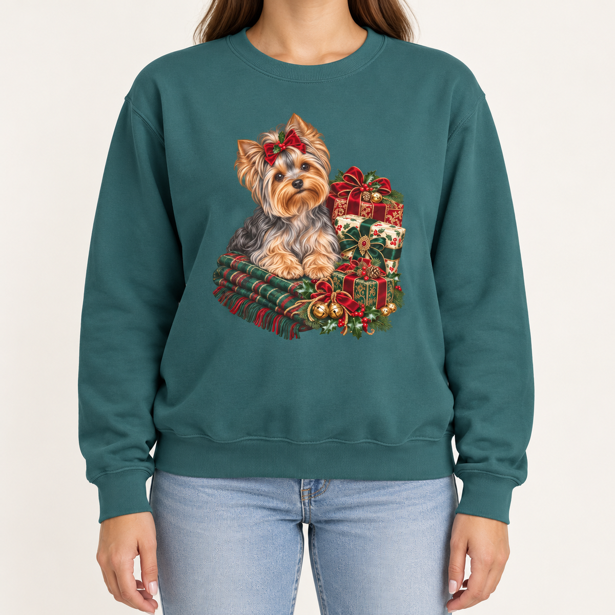 Yorkie Christmas sweatshirt – a Yorkshire terrier with a red bow on a tartan blanket beside wrapped Christmas presents, printed large on the chest of a Comfort Colors crewneck