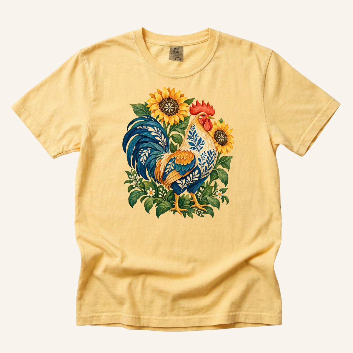 First One Up T-Shirt in Butter — a warm pairing that echoes the sunflowers and sets off the blue tail