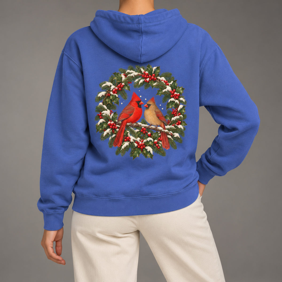 Winter Cardinal hoodie in Flo Blue worn, back view with the cardinal wreath print