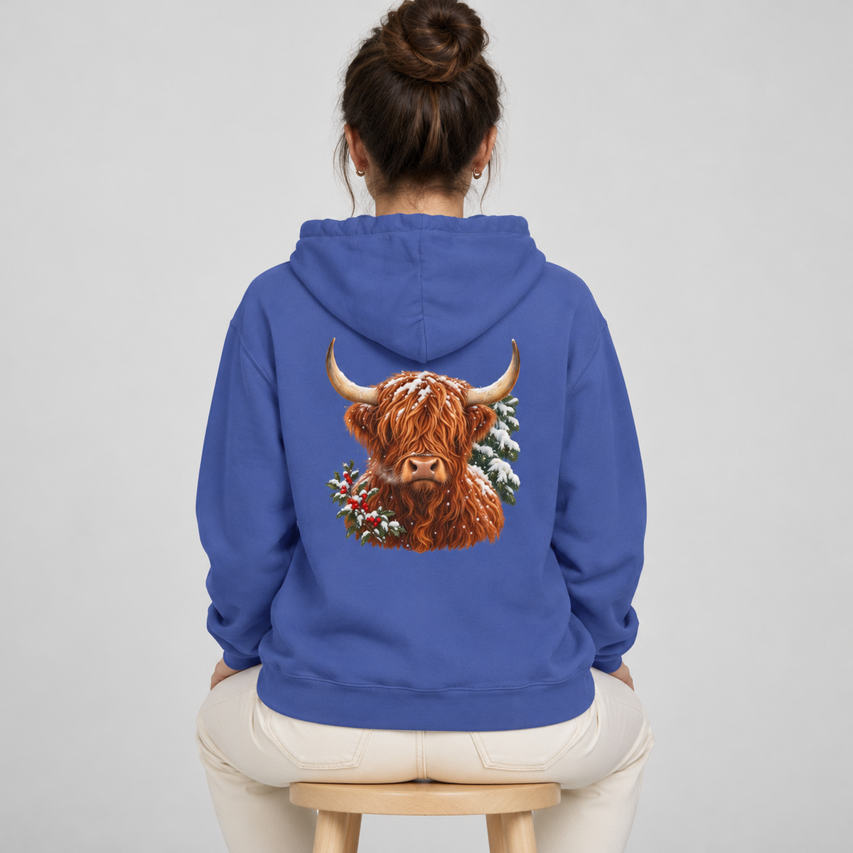 Winter Highland Cow hoodie in Flo Blue worn, back view with the highland cow portrait