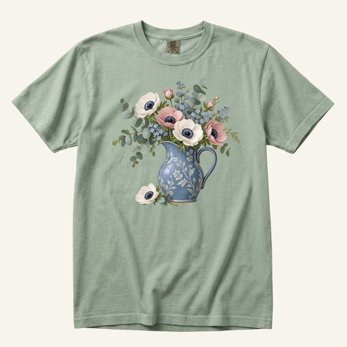 Floral Blue Pitcher T-Shirt in Bay — botanical bouquet still life on earthy green garment-dyed cotton