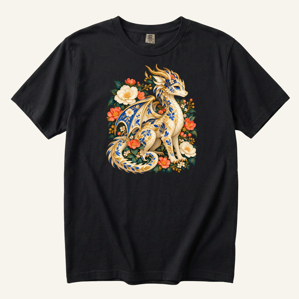 The Garden Was Her Gold floral dragon t-shirt in Black, a cream-and-gold dragon patterned with blue botanical ornament like painted porcelain, seated among coral-red flowers, ivory blossoms and deep green foliage