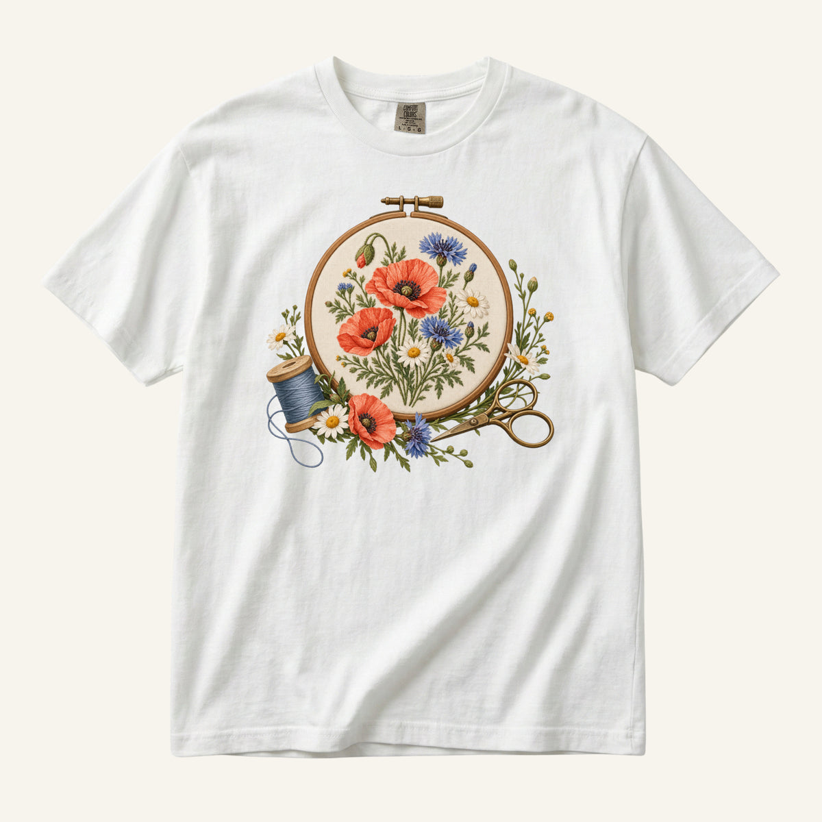 Floral Sewing T-Shirt in White — an embroidery hoop of poppies, daisies and cornflowers with thread and scissors
