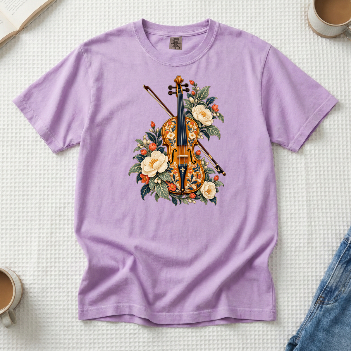 Folk-art violin and bow with cream blossoms illustration on an Orchid lilac Comfort Colors t-shirt