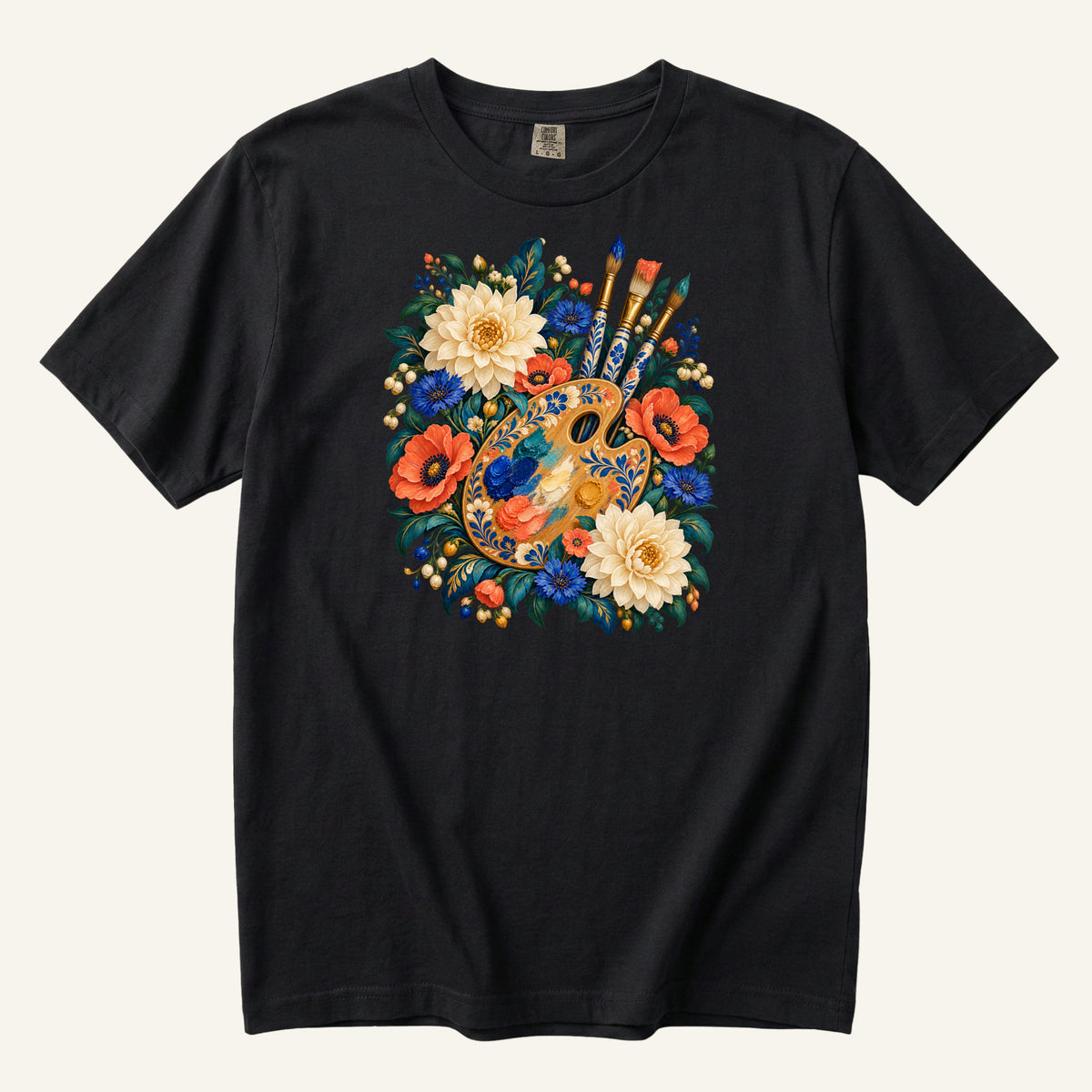 She Started with Blue floral artist palette t-shirt in Black, a golden artist's palette and upright paintbrushes surrounded by cream blossoms, coral-red flowers and deep blue blooms