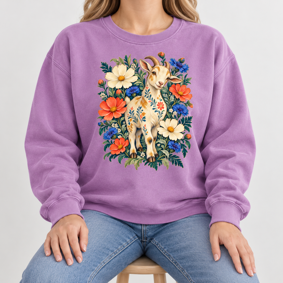 Floral goat sweatshirt shown worn, detail of the coral and blue blooms