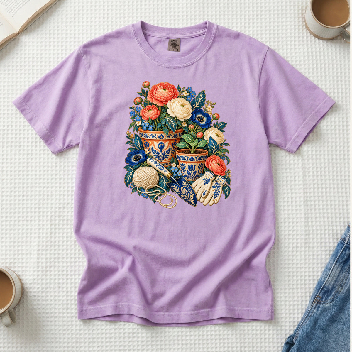 Folk Art Garden Pots T-Shirt in Orchid soft lilac — blue-and-gold plant pots with coral blooms and curling green foliage