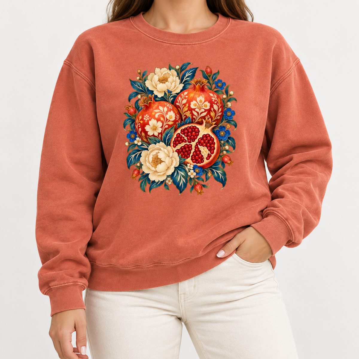 Floral pomegranate sweatshirt shown worn, showing the relaxed unisex crewneck fit
