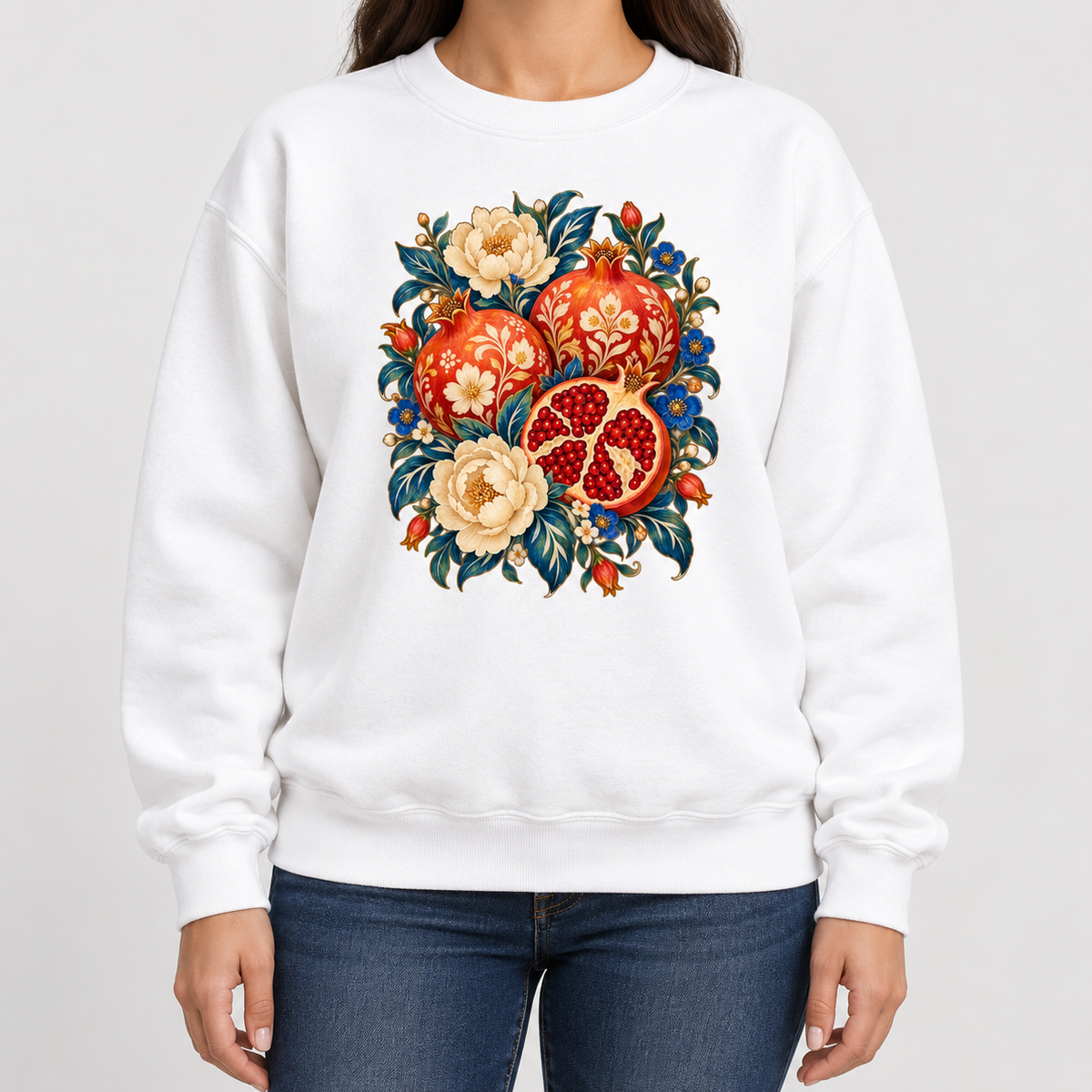 Floral pomegranate sweatshirt shown worn, closer view of the opened fruit and ruby arils