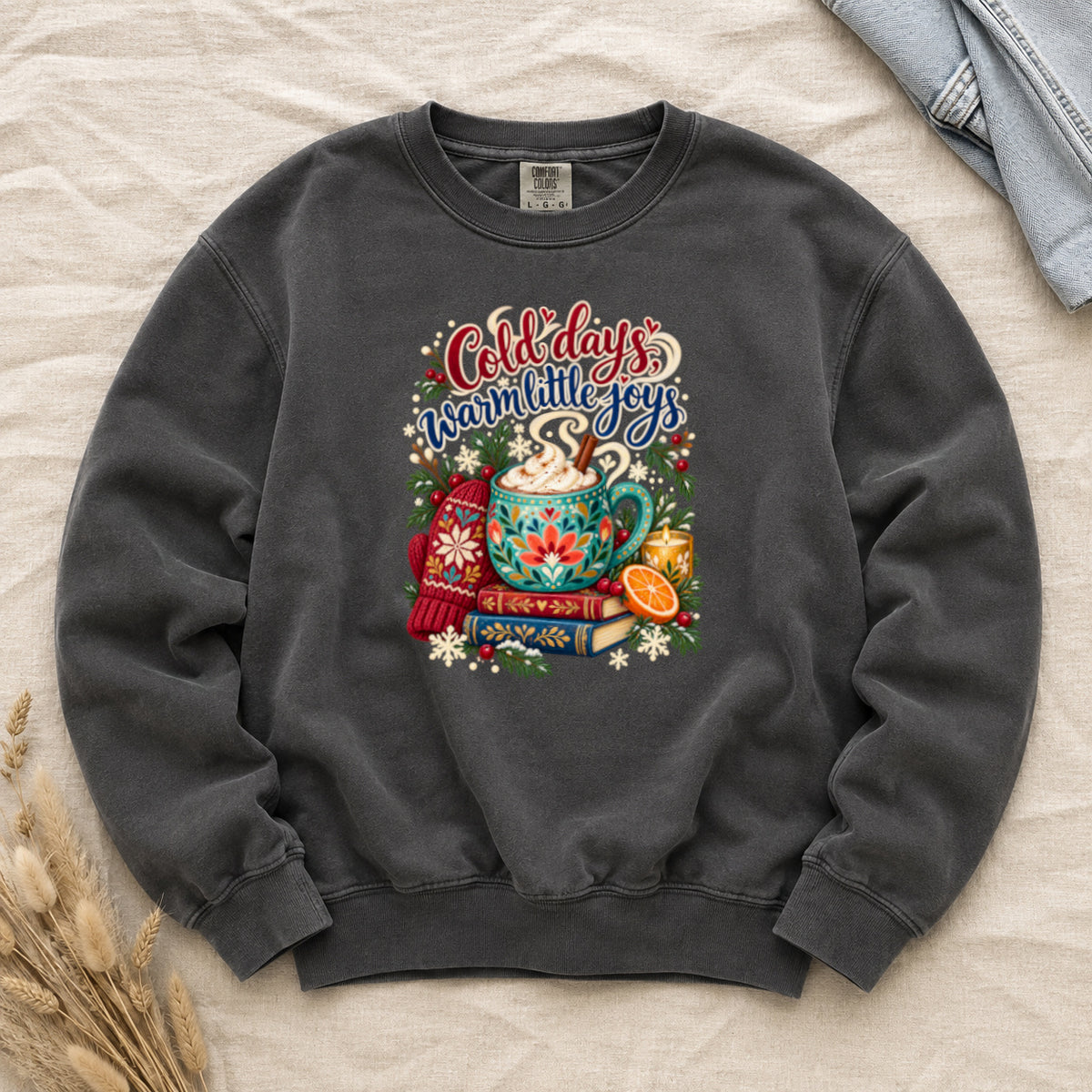 Cocoa and books winter sweatshirt in Pepper, a deep charcoal garment-dyed Comfort Colors crewneck with the cozy winter still life printed on the chest