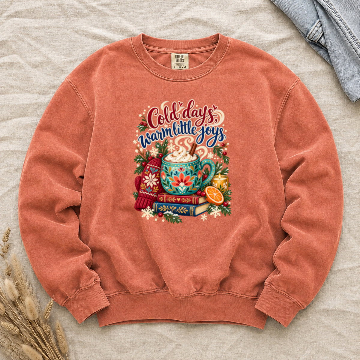 Cocoa and books winter sweatshirt in Terracotta, a warm clay garment-dyed Comfort Colors crewneck, available in L, 2XL and 3XL only