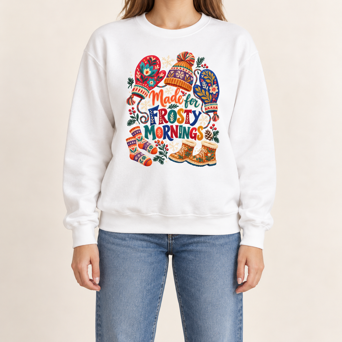 Made for Frosty Mornings winter graphic sweatshirt - folk art mittens, a pom-pom hat, a scarf, socks and snow boots with holly and berries, printed large and centered on a garment-dyed Comfort Colors crewneck