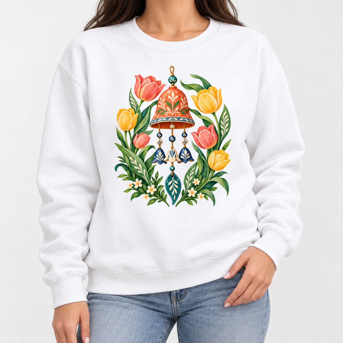 Garden wind chime and tulip sweatshirt shown worn, showing the relaxed unisex crewneck fit