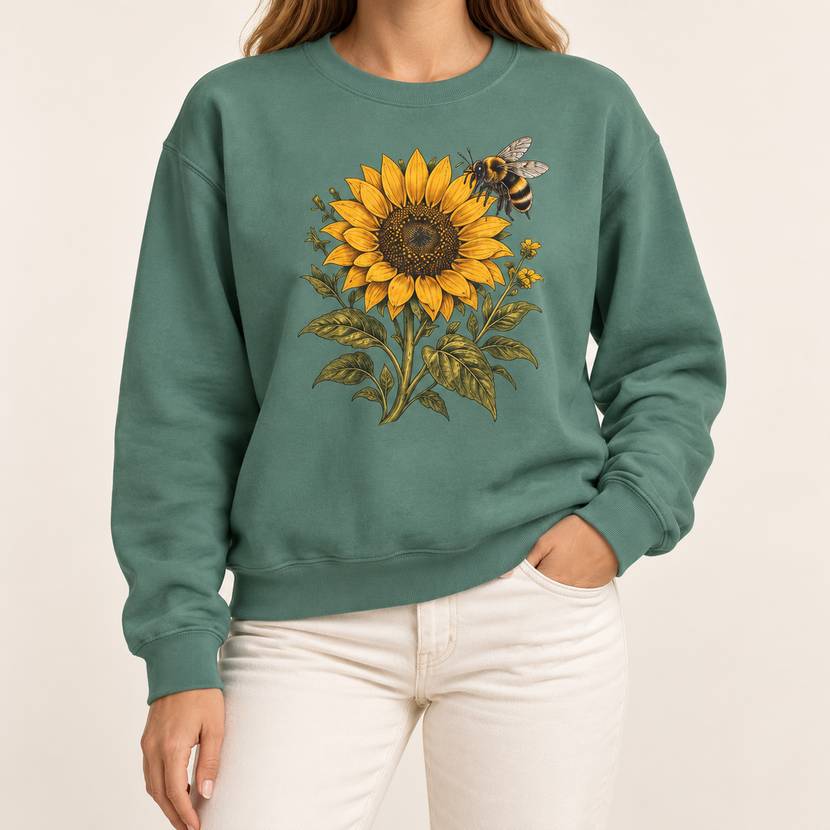 Sunflower and bumblebee sweatshirt, the golden sunflower and hovering bumblebee with olive leaves and small yellow blooms, on a garment-dyed Comfort Colors crewneck