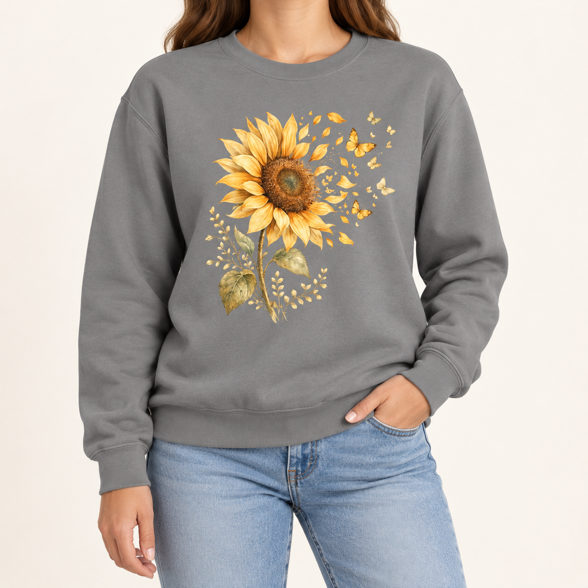 Sunflower butterfly sweatshirt – a golden watercolor sunflower letting go of its petals as small gold butterflies, printed large on the chest of a garment-dyed Comfort Colors crewneck