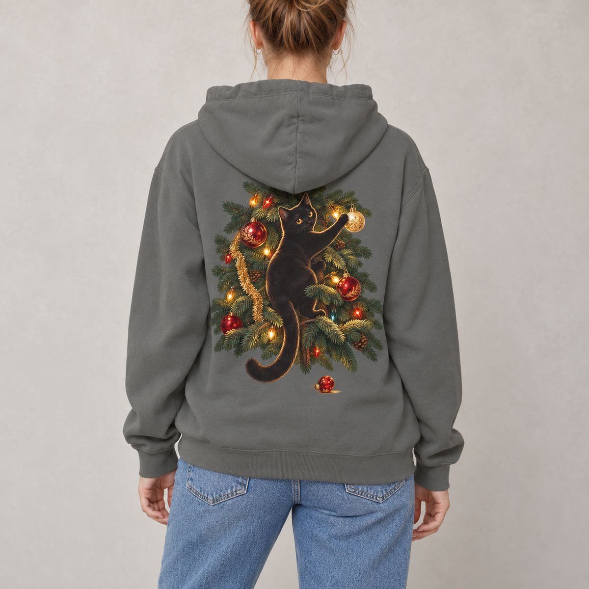 Black Cat Christmas hoodie in Grey worn, back view with the cat climbing the Christmas tree