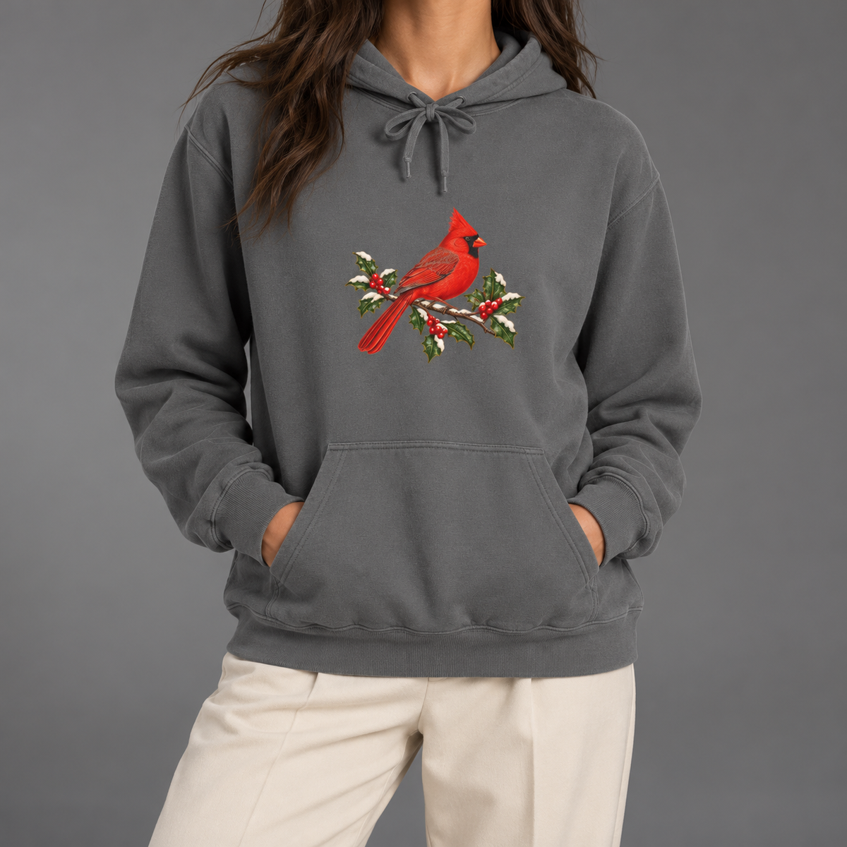 Winter Cardinal hoodie in Grey worn, front view with the cardinal on snowy holly
